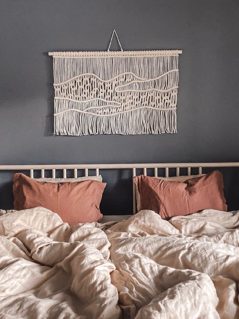 dark grey colour wall with modern macrame piece