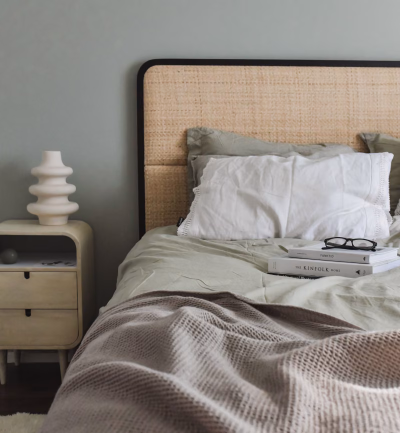 greyish green colour wall and bed with matching textile 